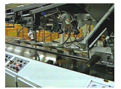 IMG: Biscuit Tray loader with heads raised